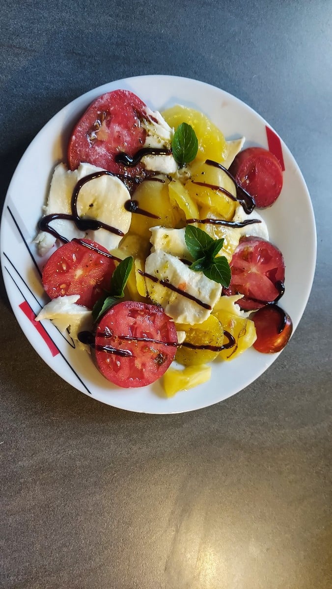 Now that the tomatoes are ripening in large quantities all at once, we had tomato and mozzarella as a side dish for our…